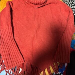 Elegant Red Turtleneck Sweater with Fringe